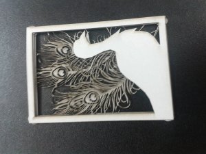 This is one of my mock up designs cut into card using the laser cutter, due to it being a quick mock up the design itself, wasn't thought out as clearly as it should of been and so the feathers doesn't sit naturally and flow with the piece, However through this mock up piece I gained an idea how how small I can make the pieces and still keep the detail that I want which was intriguing as I found I preferred the pieces on a smaller scale than i did the larger, as I feel it makes the pieces more precious.